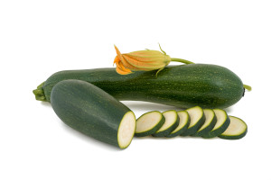 green fresh zucchini isolated on white background